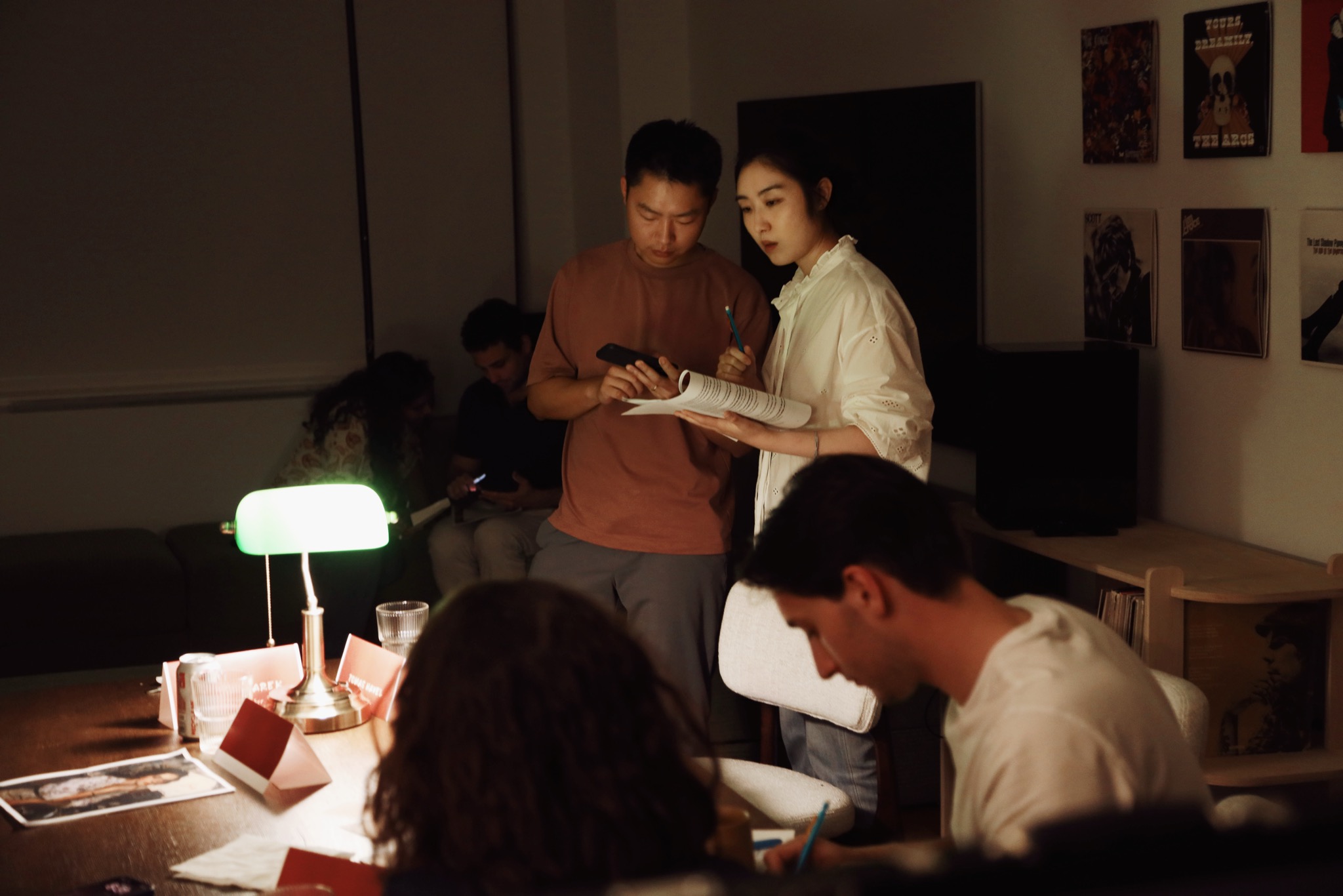 Guests comparing notes and scripts