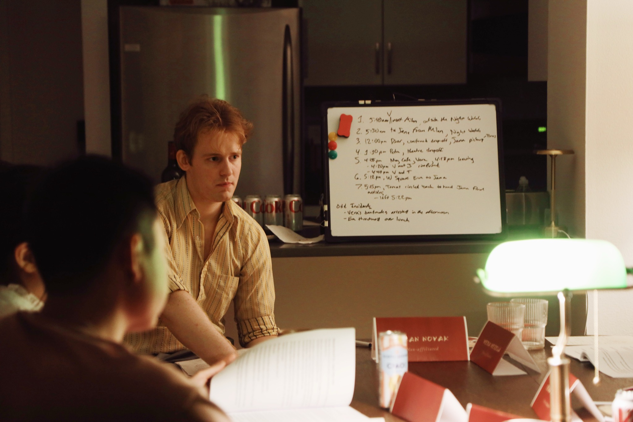 A character studies a timeline of the day's events